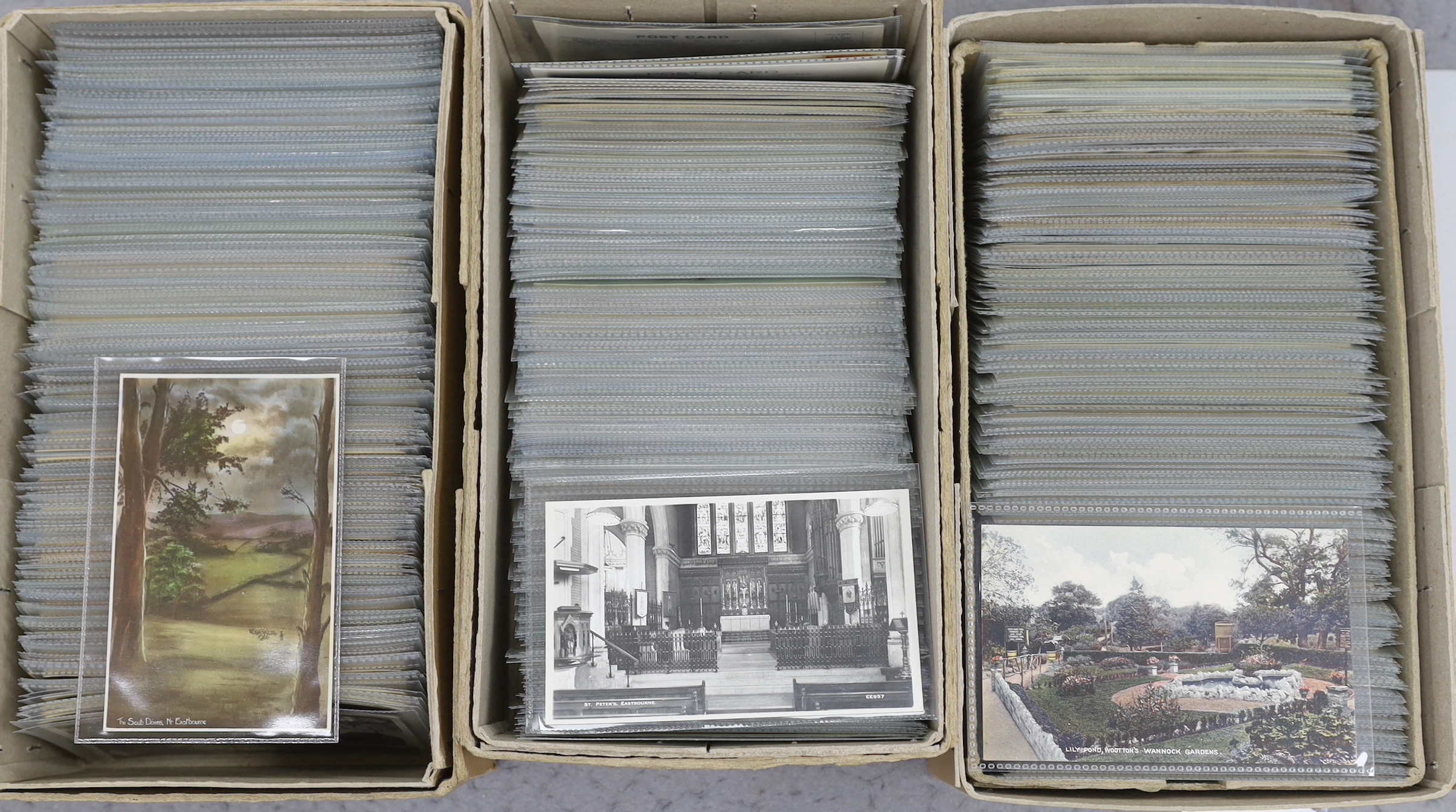 A large quantity of early to mid 20th century postcards of Eastbourne and the surrounding area, all in individual protective sleeves